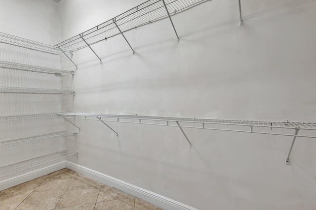 1897 SW Citation Ave, Port Saint Lucie, FL 34953 - walk in closet featuring light tile patterned floors