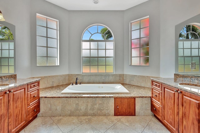 1897 SW Citation Ave, Port Saint Lucie, FL 34953 - full bathroom with two vanities, a garden tub, and tile patterned flooring