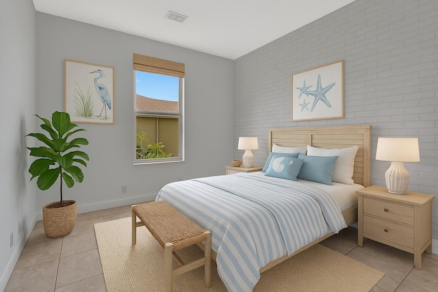 1897 SW Citation Ave, Port Saint Lucie, FL 34953 - bedroom featuring light tile patterned floors and an accent wall