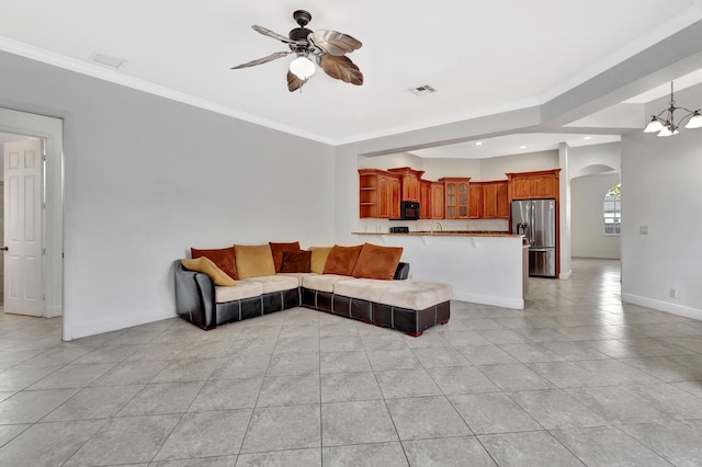 1897 SW Citation Ave, Port Saint Lucie, FL 34953 - living area with a ceiling fan, a chandelier, light tile patterned floors, arched walkways, and baseboards
