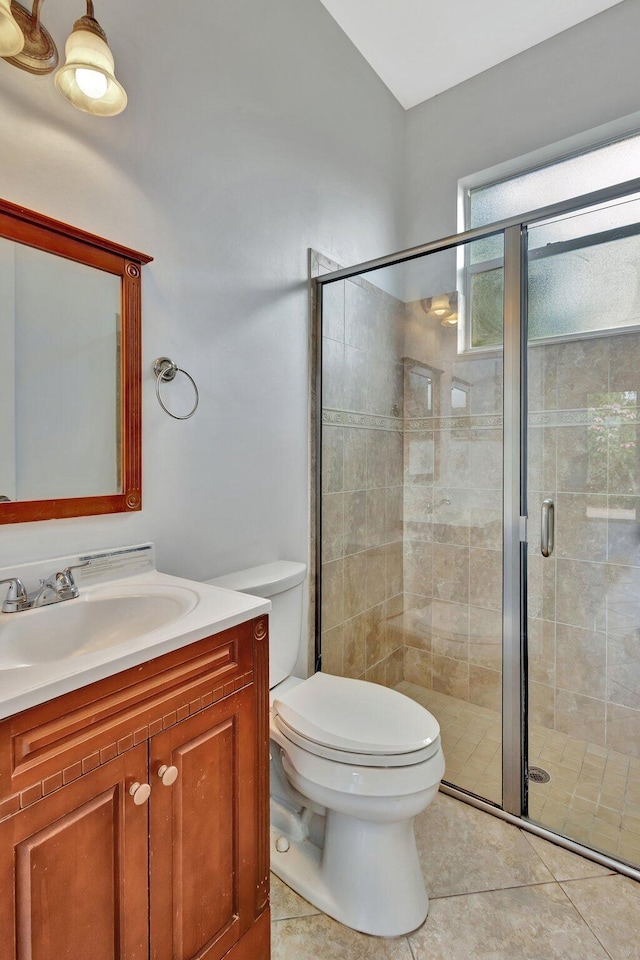 1897 SW Citation Ave, Port Saint Lucie, FL 34953 - full bathroom with toilet, vanity, tile patterned flooring, and a shower stall