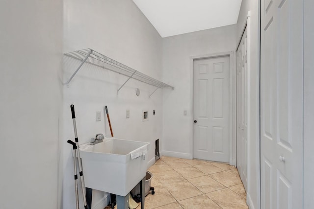 1897 SW Citation Ave, Port Saint Lucie, FL 34953 - laundry area featuring washer hookup, light tile patterned flooring, and baseboards