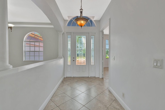 1897 SW Citation Ave, Port Saint Lucie, FL 34953 - foyer entrance with ornate columns, baseboards, and plenty of natural light