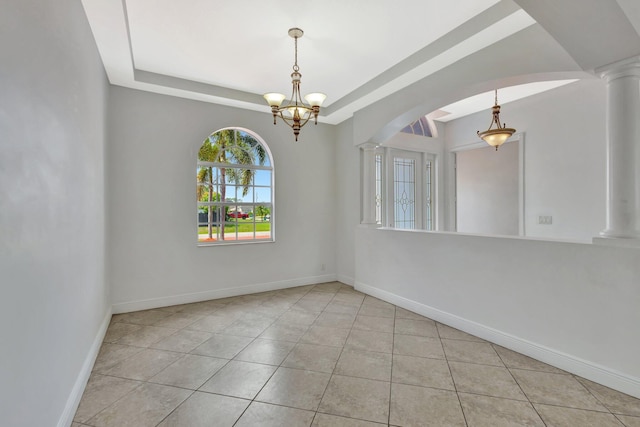 1897 SW Citation Ave, Port Saint Lucie, FL 34953 - unfurnished room with ornate columns, a chandelier, tile patterned floors, and arched walkways