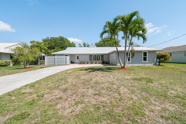 4873 SE Pilot Way, Stuart, FL 34997 - ranch-style home featuring driveway, stucco siding, a garage, and metal roof