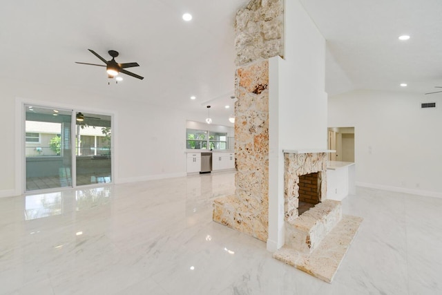 4873 SE Pilot Way, Stuart, FL 34997 - unfurnished living room featuring a ceiling fan, marble tiled flooring, healthy amount of natural light, recessed lighting, and vaulted ceiling