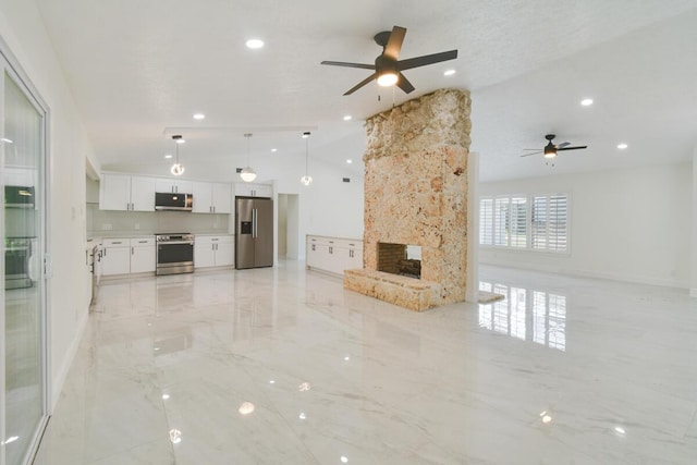 4873 SE Pilot Way, Stuart, FL 34997 - unfurnished living room with ceiling fan, a multi sided fireplace, light marble finish flooring, baseboards, and recessed lighting