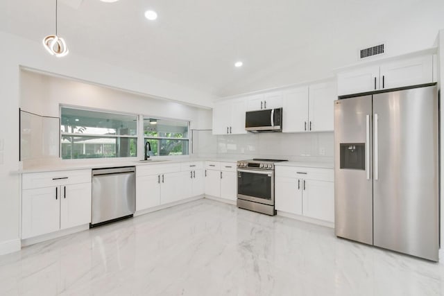4873 SE Pilot Way, Stuart, FL 34997 - kitchen featuring appliances with stainless steel finishes, white cabinetry, backsplash, light countertops, and recessed lighting