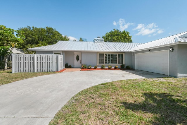 4873 SE Pilot Way, Stuart, FL 34997 - ranch-style house with stucco siding, concrete driveway, a garage, metal roof, and a chimney