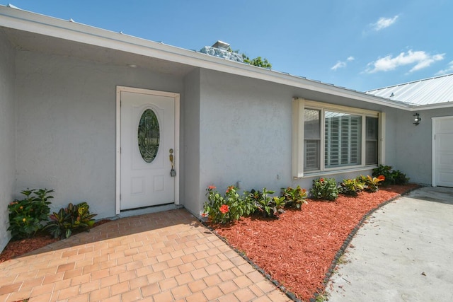 4873 SE Pilot Way, Stuart, FL 34997 - view of exterior entry with stucco siding