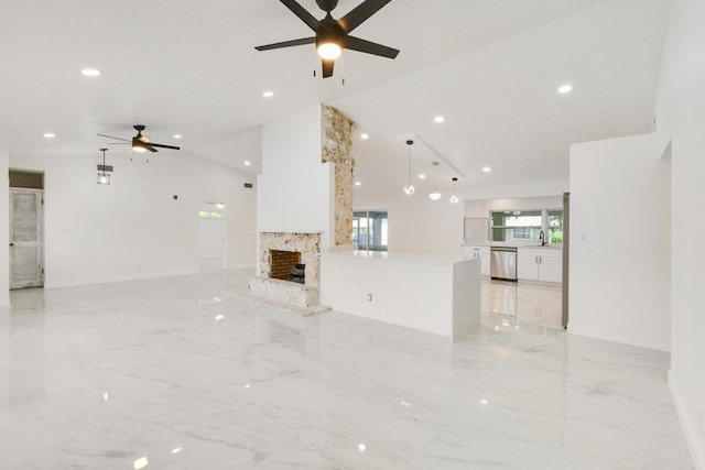 4873 SE Pilot Way, Stuart, FL 34997 - unfurnished living room featuring a ceiling fan, light marble finish flooring, recessed lighting, a fireplace, and a sink