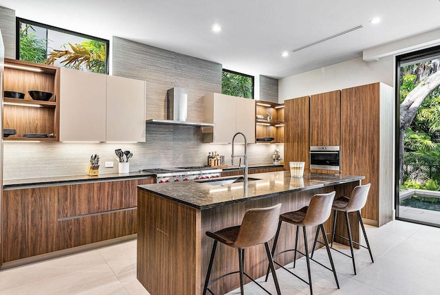 775 Park Dr W, Boca Raton, FL 33432 - kitchen with open shelves, modern cabinets, a sink, wall chimney exhaust hood, and oven