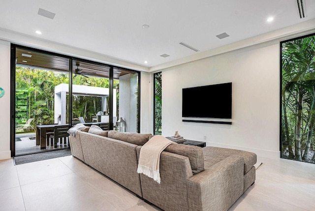 775 Park Dr W, Boca Raton, FL 33432 - living room with recessed lighting, light tile patterned flooring, floor to ceiling windows, and baseboards