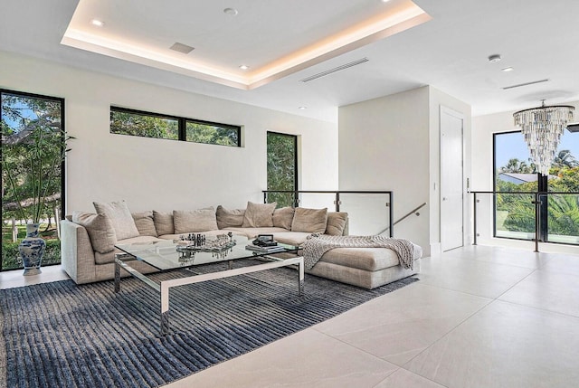 775 Park Dr W, Boca Raton, FL 33432 - living area featuring a chandelier, a raised ceiling, and recessed lighting