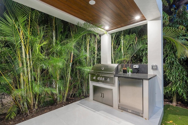 775 Park Dr W, Boca Raton, FL 33432 - view of patio featuring a garage and driveway