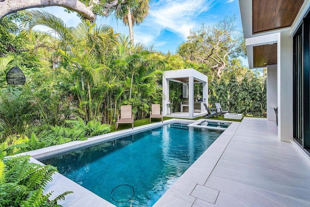775 Park Dr W, Boca Raton, FL 33432 - view of swimming pool with a pool with connected hot tub and a patio