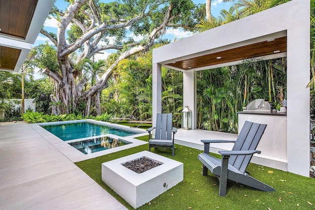 775 Park Dr W, Boca Raton, FL 33432 - view of swimming pool featuring area for grilling, an outdoor fire pit, a patio area, a lawn, and a pool with connected hot tub