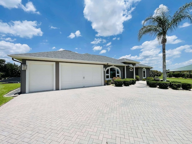 1036 Greenway Ter, Sebring, FL 33876 - single story home with decorative driveway, an attached garage, and stucco siding