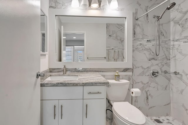 187 Seville H, Delray Beach, FL 33446 - bathroom featuring vanity, a marble finish shower, and toilet