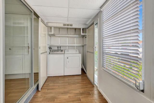 187 Seville H, Delray Beach, FL 33446 - washroom with separate washer and dryer and wood finished floors
