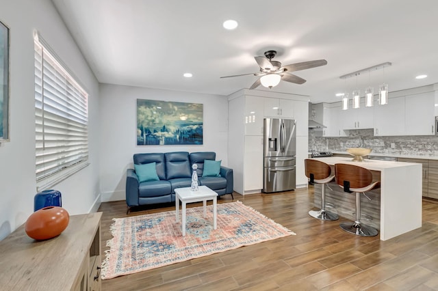 187 Seville H, Delray Beach, FL 33446 - living room featuring a ceiling fan, light wood-style flooring, recessed lighting, and baseboards