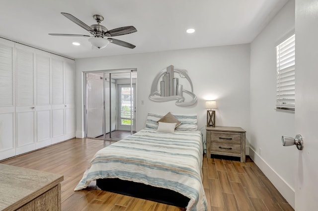 187 Seville H, Delray Beach, FL 33446 - bedroom with wood finished floors, recessed lighting, access to outside, baseboards, and a ceiling fan