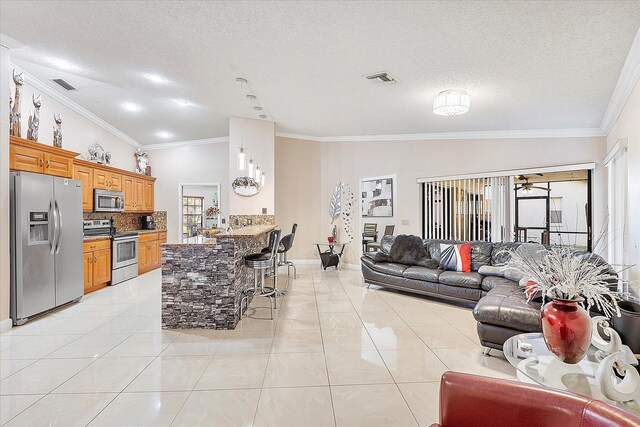 2326 NW 96th Way, Coral Springs, FL 33065 - living area featuring a textured ceiling, plenty of natural light, ornamental molding, and lofted ceiling