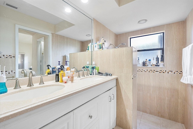2326 NW 96th Way, Coral Springs, FL 33065 - full bathroom with walk in shower, double vanity, tile walls, and tile patterned flooring