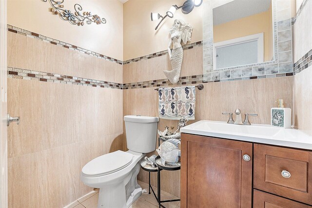 2326 NW 96th Way, Coral Springs, FL 33065 - bathroom with tile walls, vanity, toilet, and tile patterned floors