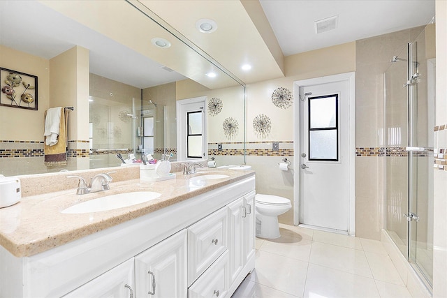 2326 NW 96th Way, Coral Springs, FL 33065 - bathroom featuring a shower stall, double vanity, toilet, tile patterned floors, and recessed lighting