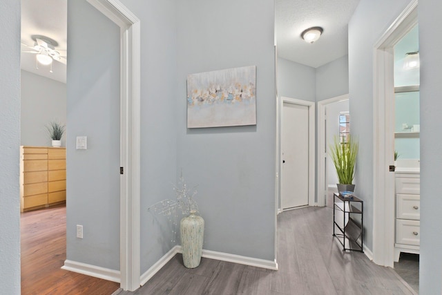 3288 SW Majestic Ct, Palm City, FL 34990 - foyer featuring wood finished floors and baseboards