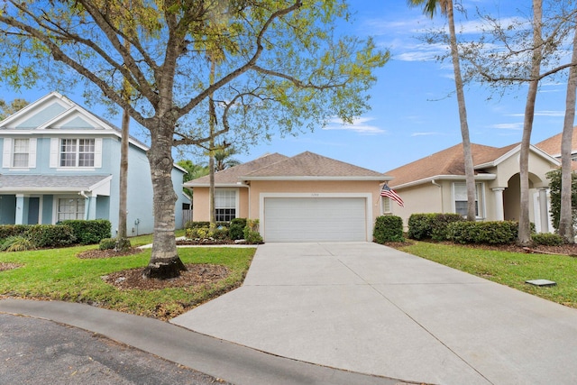 3288 SW Majestic Ct, Palm City, FL 34990 - view of front of property featuring an attached garage, driveway, stucco siding, and a front lawn