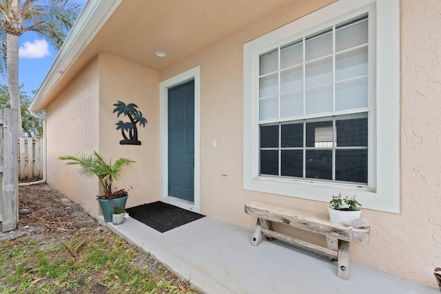 3288 SW Majestic Ct, Palm City, FL 34990 - property entrance with stucco siding