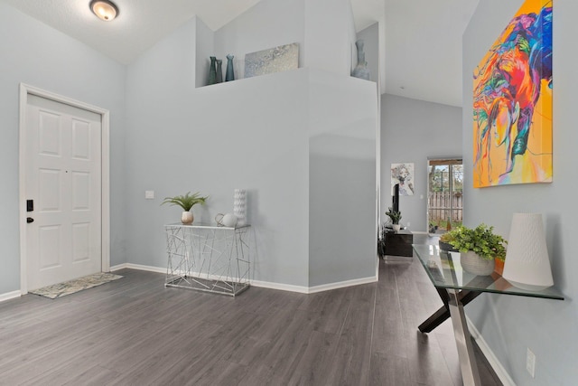 3288 SW Majestic Ct, Palm City, FL 34990 - entryway featuring high vaulted ceiling, wood finished floors, and baseboards