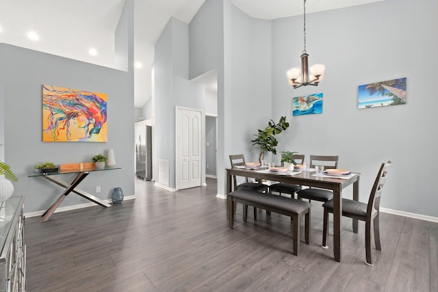 3288 SW Majestic Ct, Palm City, FL 34990 - dining area featuring a chandelier, dark wood-style flooring, baseboards, high vaulted ceiling, and recessed lighting