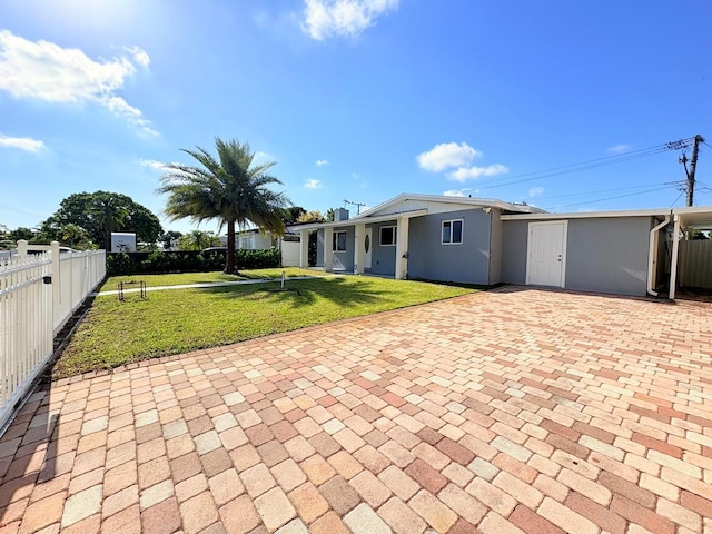 1034 Almeria Rd, West Palm Beach, FL 33405 - view of front of property with stucco siding and a patio area