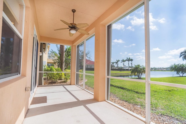 5704 Spanish River Rd, Fort Pierce, FL 34951 - unfurnished sunroom with a water view, a ceiling fan, and concrete floors