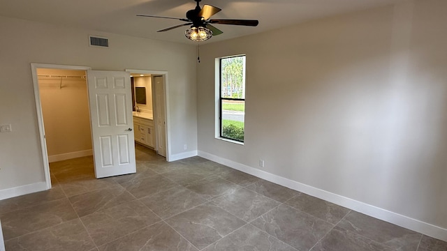 5800 Coach House Cir Unit B, Boca Raton, FL 33486 - unfurnished bedroom featuring a spacious closet, baseboards, a closet, and ceiling fan