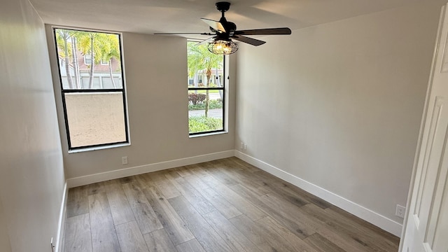 5800 Coach House Cir Unit B, Boca Raton, FL 33486 - spare room with plenty of natural light, a ceiling fan, wood finished floors, and baseboards