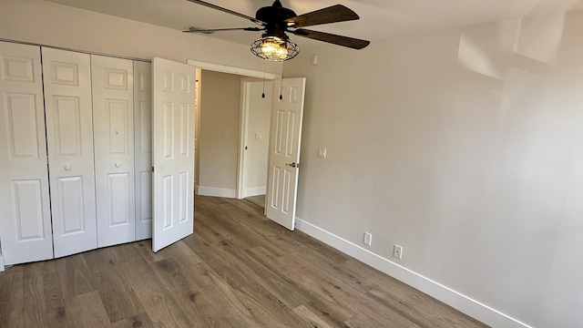 5800 Coach House Cir Unit B, Boca Raton, FL 33486 - unfurnished bedroom with a closet, wood finished floors, baseboards, and ceiling fan
