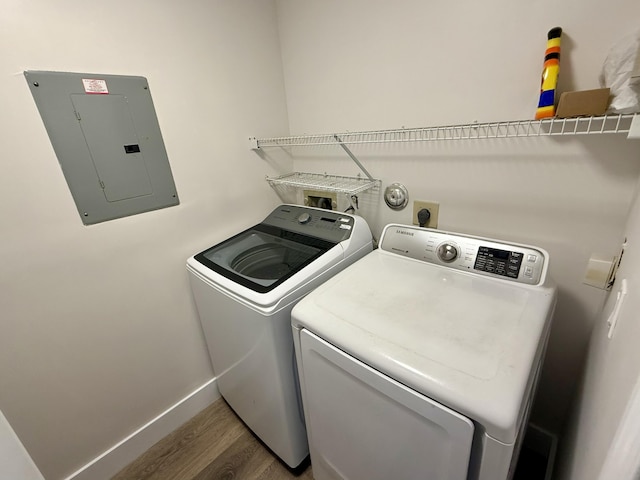 5800 Coach House Cir Unit B, Boca Raton, FL 33486 - washroom featuring electric panel, independent washer and dryer, wood finished floors, and baseboards