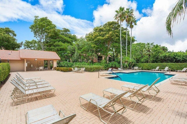 5800 Coach House Cir Unit B, Boca Raton, FL 33486 - community pool featuring a patio and view of wooded area