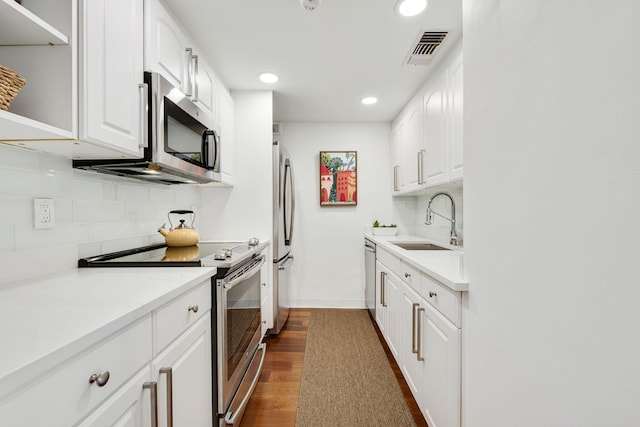 354 Chilean Ave Unit 3E, Palm Beach, FL 33480 - kitchen featuring stainless steel appliances, a sink, open shelves, recessed lighting, and backsplash