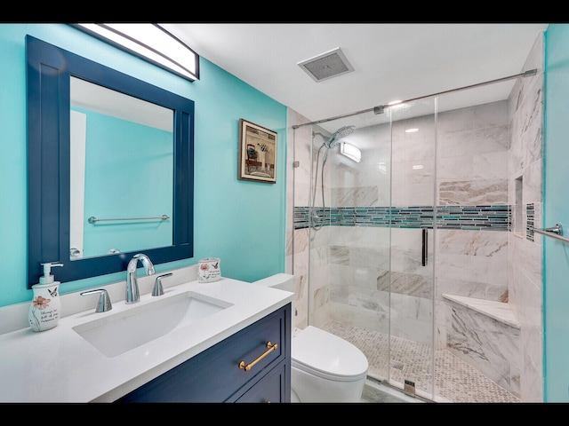 2400 Presidential Way Unit 401, West Palm Beach, FL 33401 - bathroom with vanity, toilet, and a shower stall