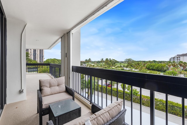 2400 Presidential Way Unit 401, West Palm Beach, FL 33401 - balcony with outdoor lounge area