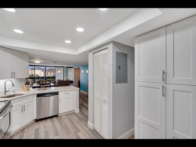 2400 Presidential Way Unit 401, West Palm Beach, FL 33401 - kitchen featuring stainless steel appliances, a sink, electric panel, light wood finished floors, and baseboards