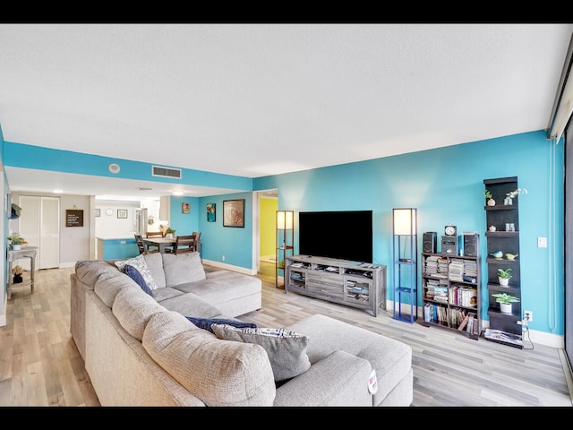 2400 Presidential Way Unit 401, West Palm Beach, FL 33401 - living room with wood finished floors and baseboards