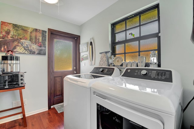 438 Pine Villa Dr, Atlantis, FL 33462 - laundry room with washer and clothes dryer, dark wood finished floors, and baseboards