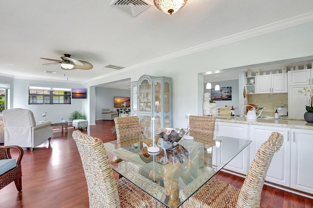 438 Pine Villa Dr, Atlantis, FL 33462 - dining space featuring ornamental molding, dark wood finished floors, and a ceiling fan