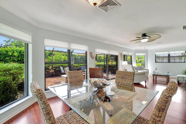438 Pine Villa Dr, Atlantis, FL 33462 - dining room featuring a ceiling fan, wood finished floors, and crown molding